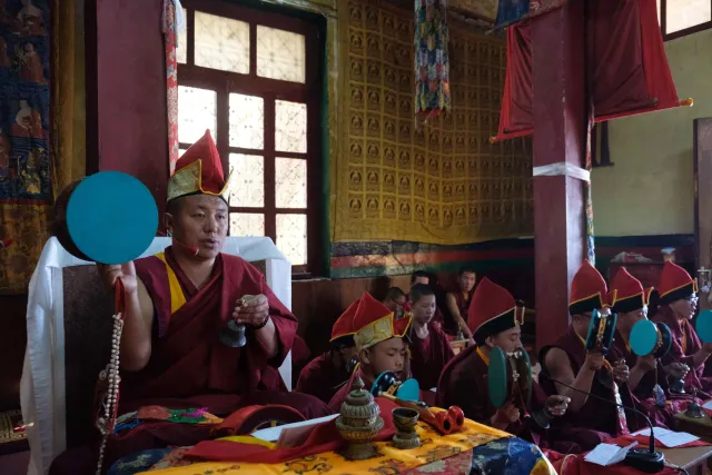 Monks sounding ritual drums and cymbals during temple ceremonies